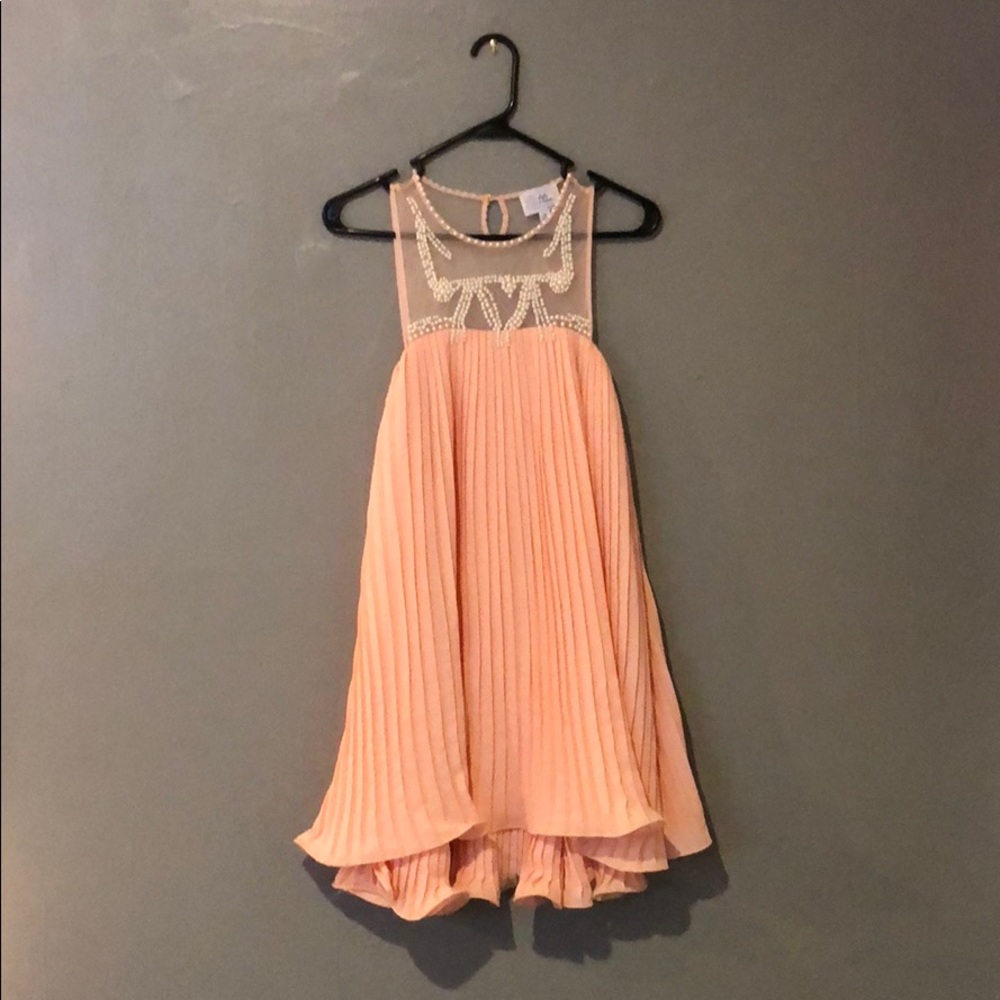 peach dress with pearl design. only worn once.